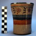 Cup. Greyish slip, polished on exterior only, with design in rust, blue & black