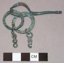 Fibula with ring and fragment of chain