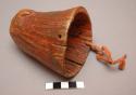 Crow bison horn cup. Rough interior and exterior. Covered w/ red pigment