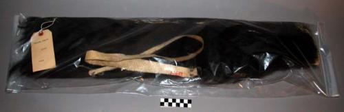 Quiver of black bear skin with rawhide carrying strap.