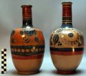 Long-necked painted pottery vases with stoppers (2)