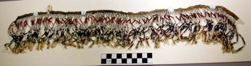 Necklace of vari-colored beads and fawn's teeth. Fringe sewn to a narrow thong.