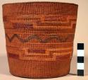 Tlingit closed twine basket. Red, golden and black false embroidery.
