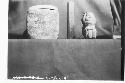 Archaic mudstone figurine and jar in which it was found in altar of Temple E-II,