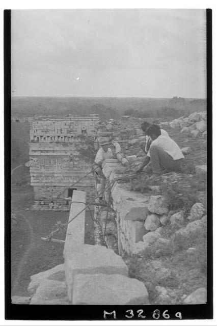 Gus constructing movable scaffolding for measuring masks at Monjas