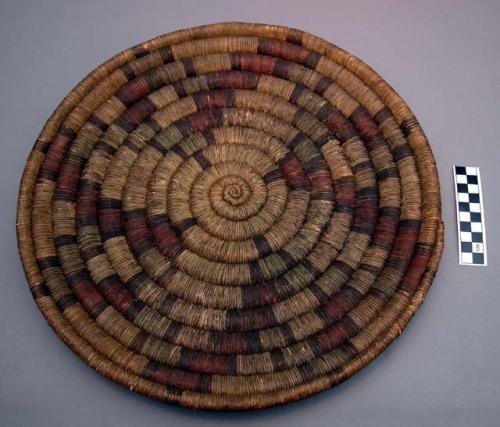 Coiled basketry tray with polychrome designs