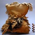 Shaman's cap of buckskin. Fringed and ornamented with owl's head.