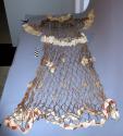 Woman's dance dress. Made of hemp twine netted in meshes.