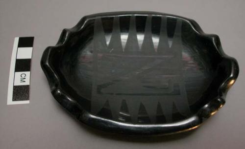 Black-on-black ashtray