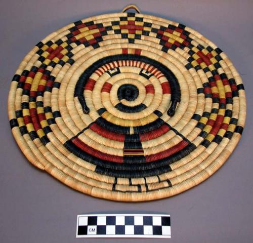 Coiled circular plaque with Grandmother kachina motif