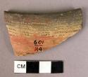 Incised polished red ware sherd, black mouth