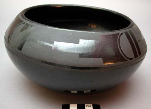 Pot after firing black in dung fire (12th step). Part of pottery series