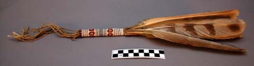 Kiowa dance wand. Beaded handle with feathers, quill and twisted leather