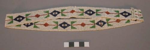 Loom beadwork in green, red, and blue on white--from a headdress