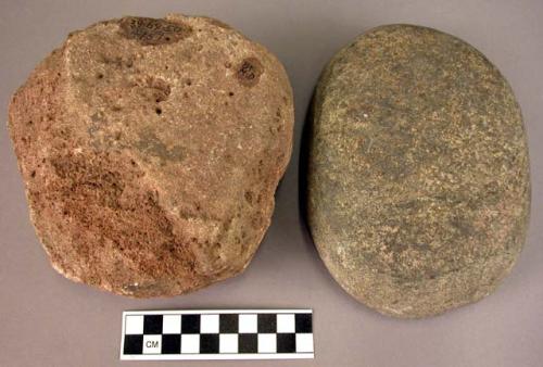 4 whole or fragmentary disc-shaped rubbing stones of various rock materials