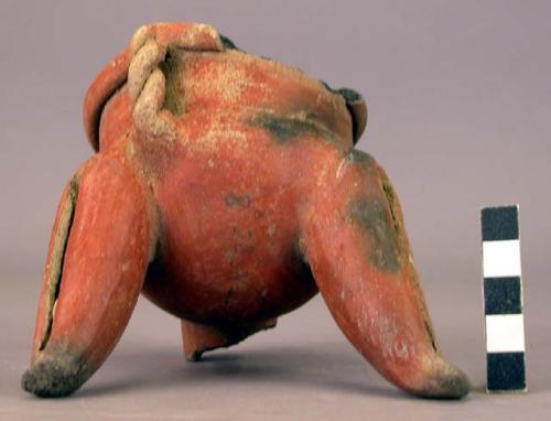 Pottery dish, tripod, legs hollow with clay balls