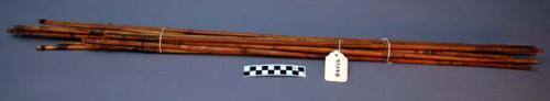 Arrows? Only wooden shafts with sinew remain. Some painted.