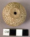 Pottery spindle whorl with incised designs