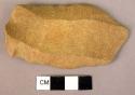 Stone tool, one flaked surface; one plain.  Possibly a scraper.  Slight convexit