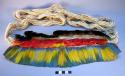 Headdress, woven band w/ rows of black, red, & blue/yellow feathers, long ties