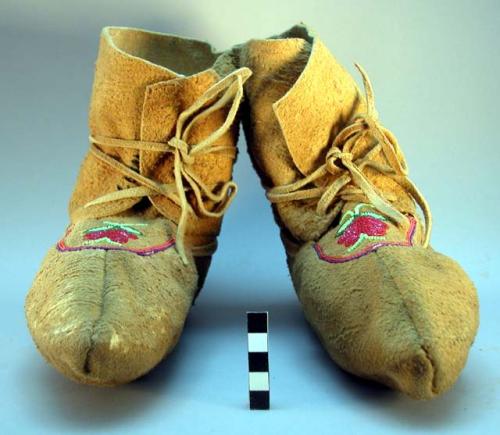 One pair Indian moccasins; smoke cured with beaded decoration and dyed gut (?);