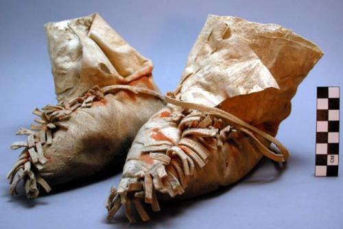 Pair of woman's buckskin moccasins. Painted along seams.