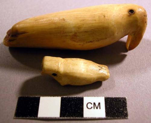 Ivory pendants representing walrus