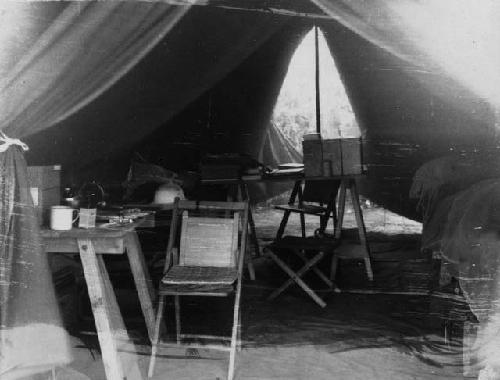 Tables and chairs inside an expedition tent