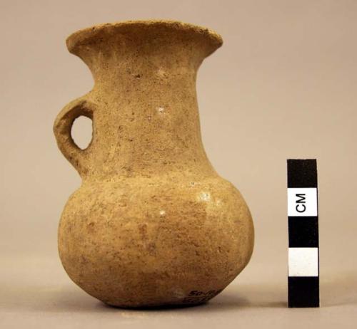 Tall-necked pottery vessel