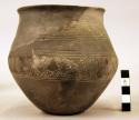 Incised gray pottery vessel