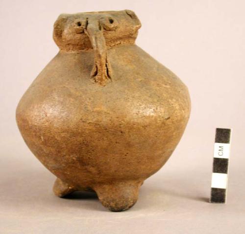 Unpainted pottery jar - decoration in form of face on rim