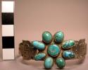 Cuff bracelet with floral turquoise cluster and birds