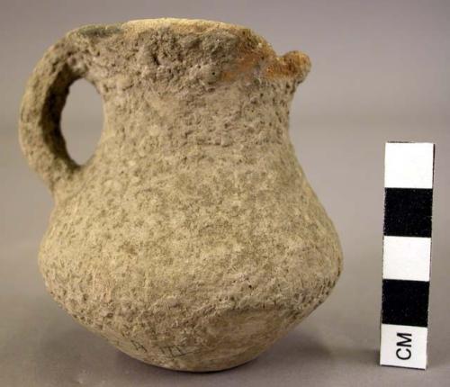 Small handled pottery cup