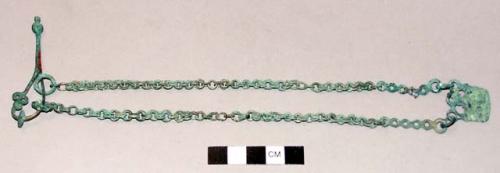 Fibula with chains & pendants