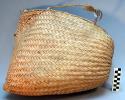 Large triangular basketry bag with handle