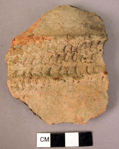 Potsherd with filletted ridges and rows of short incised lines