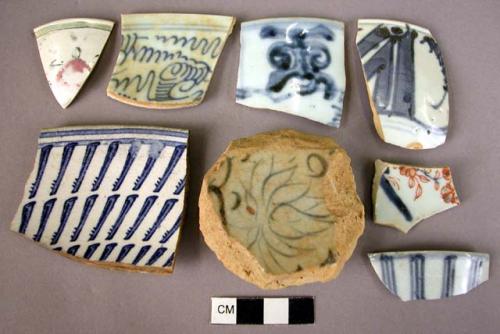 Cup and bowl fragments, blue and white, handpainted.  Few porcelain; mostly chin