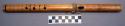 Wooden flute with burnt punctate decoration