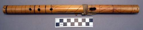 Wooden flute with burnt punctate decoration