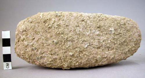 Quartzite muller, superficially shaped like celt