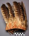 Shoulder sash of buckskin set with 34 owl feathers. Ends fringed. Worn by men