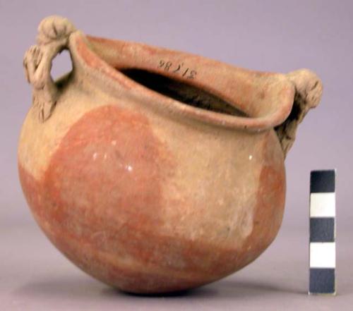 Pottery jar, handles connected with lip, plastic work and rudely carved to