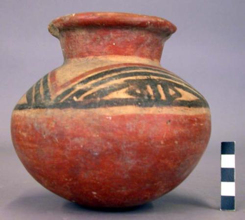 Pottery jar, red base with black and red ornament on upper yellow zone