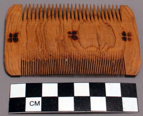 2 wooden combs; 3 3/4 x 2 1/4"