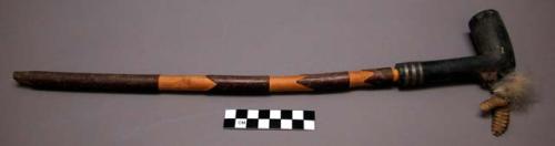 Pipe, carved wood shaft, dark & natural, ground stone bowl, incised, 3 ring lead inlay, rattlesnake rattle & feather decoration