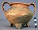 Tripod pottery bowl - flaring strap handles, coarse tempered