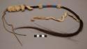Sioux ornament, possibly ear pendant. Braided horsehair w/ ermine wrapped around