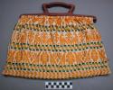 Knitting bag: rows of yellow figures; between rows is a black, green, and yell