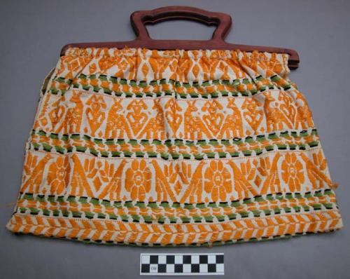 Knitting bag: rows of yellow figures; between rows is a black, green, and yell