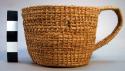 Coiled basket cup of buriti frond straw